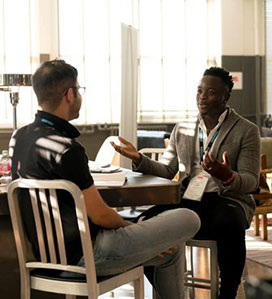 Two men meeting in a mentoring program with discussing their expectations.