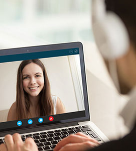 Two people meeting virtually for regularly-scheduled mentoring meetings.
